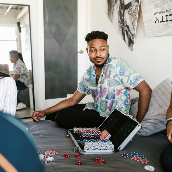 Diverse group of people smiling in a bright, modern room.